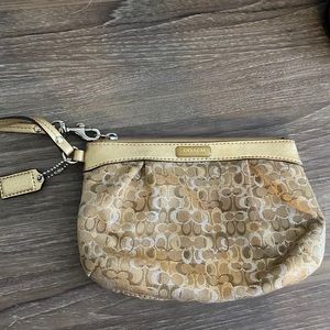 Gold coach wristlet